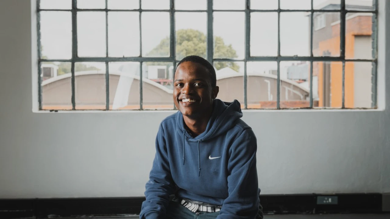 Close up on a plate of mashed potatoes, topped with baked pork chops with cream of mushroom soup, and a side of green beans.