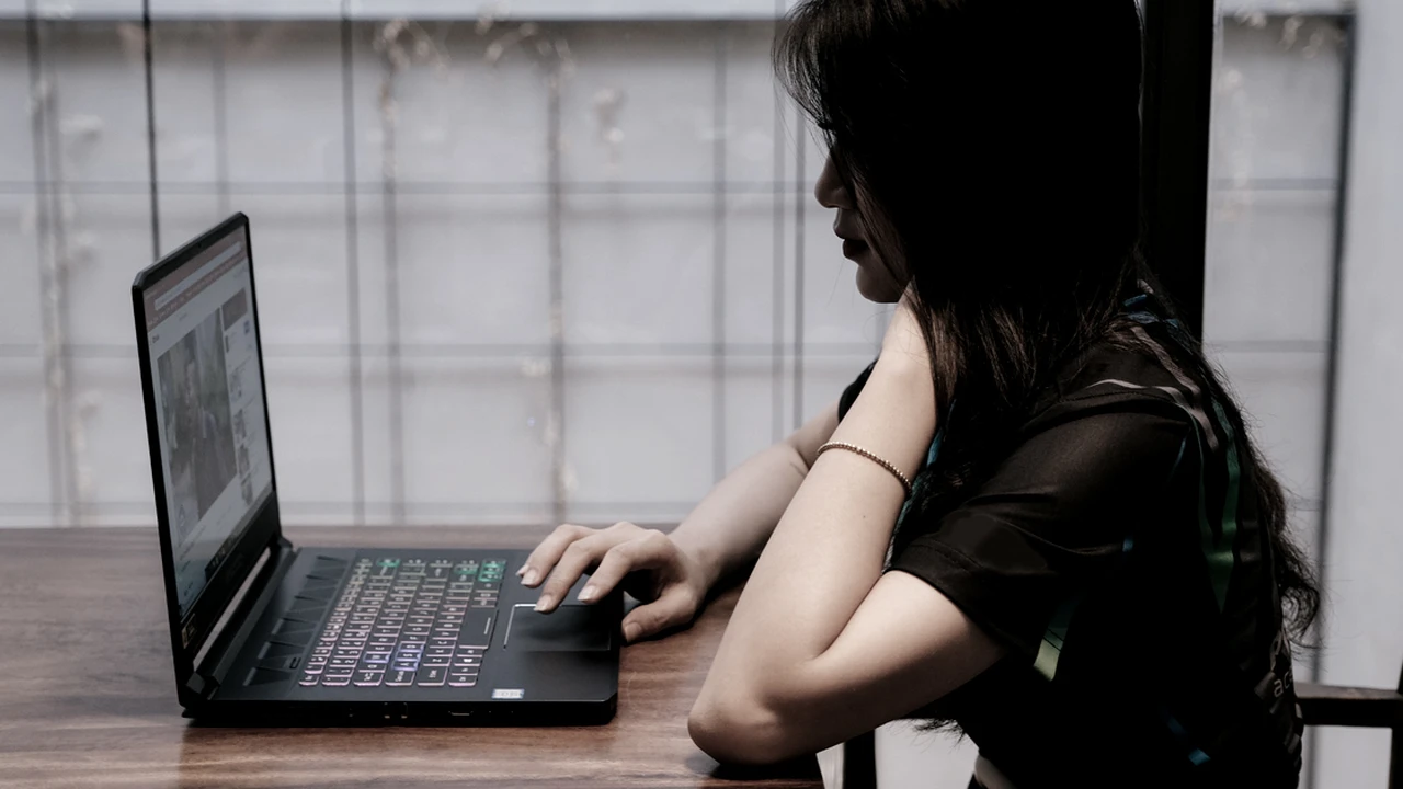 Close up on a plate of mashed potatoes, topped with baked pork chops with cream of mushroom soup, and a side of green beans.