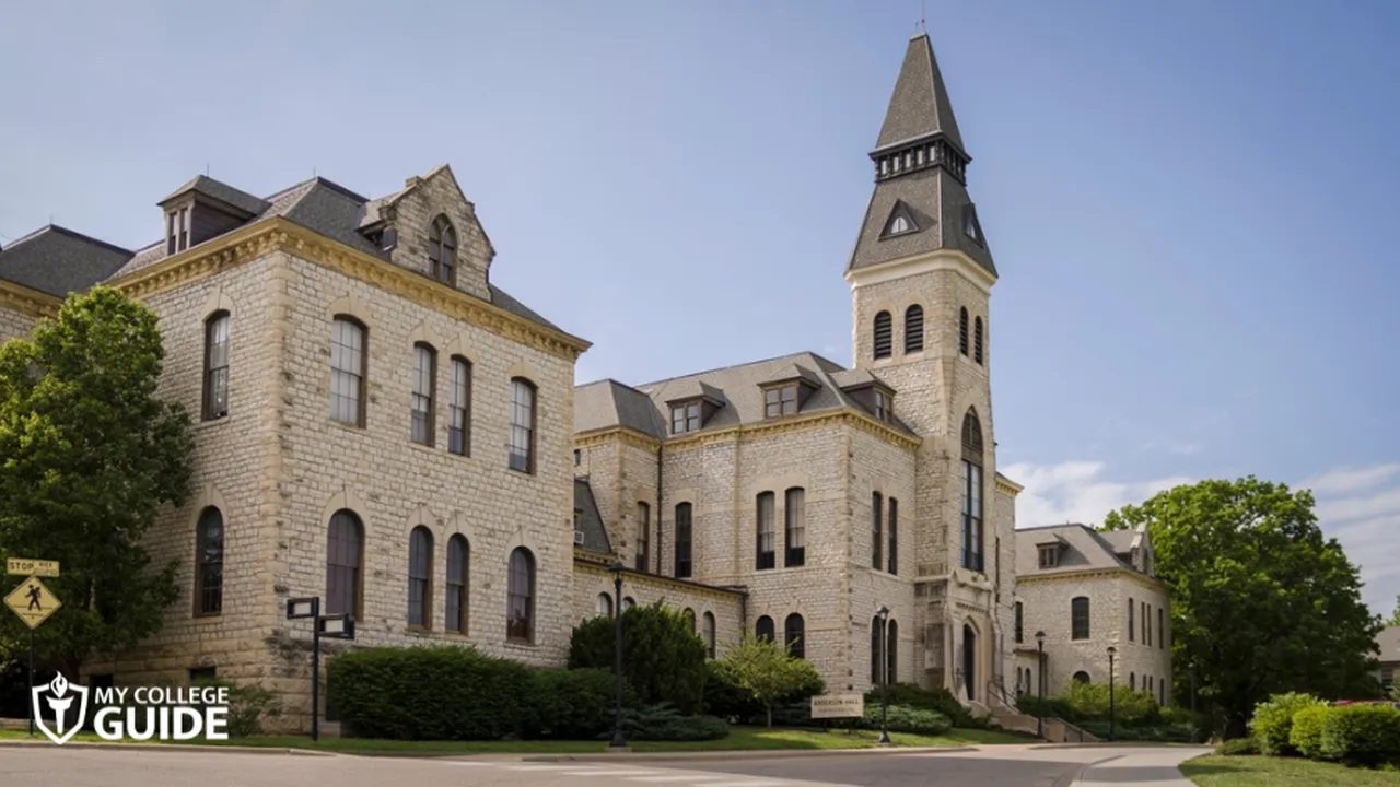 Two mint chocolate milkshakes with whipped cream and green sprinkles.